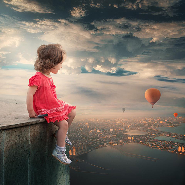 Girl looking at balloons
