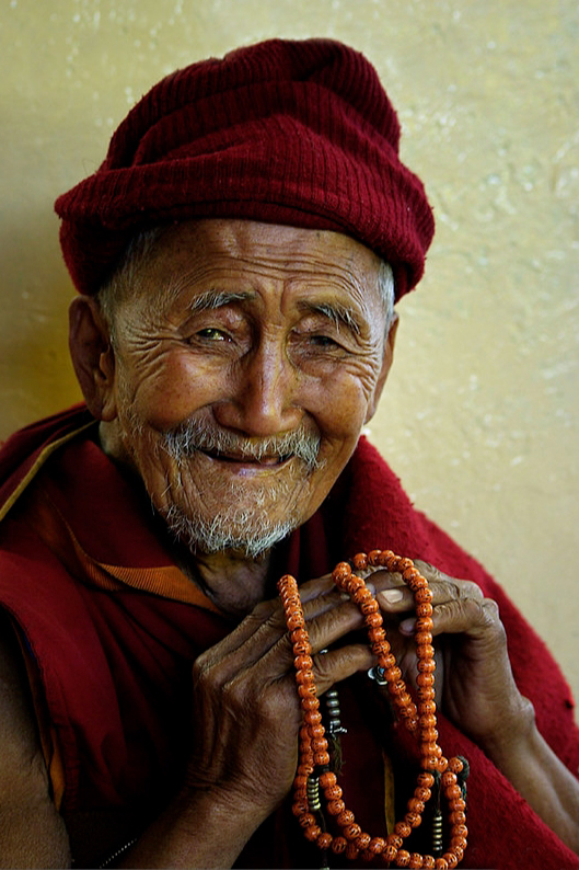 Smiling tibetan monk