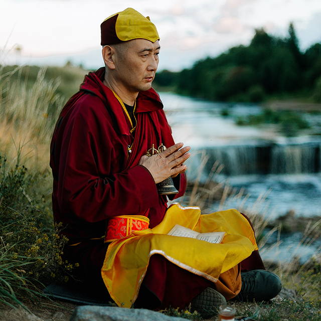 Tibetan monk nature river