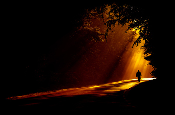 6man walking towards the light