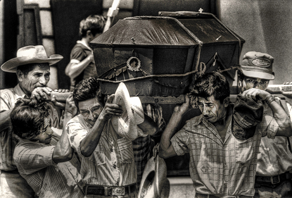 carrying a coffin